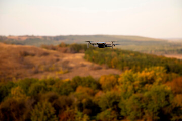 Drone flying upon the autumn forest
