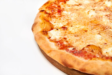 Pizza with cheese and tomatoes on wooden board. Close-up, selective focus.