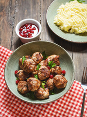 Swedish meatballs with mashed potatoes and green beans.
