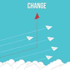 Think differently. Red airplane changing direction. New idea, change, trend, courage, creative solution, innovation and unique way concept.	