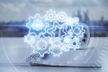 Double exposure of business theme drawings and desk with open notebook background. Concept of...