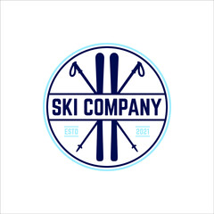 Ski board and sticks in a retro round badge