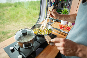 Cooking food on a stove inside a caravan 