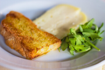 Сheese, arugula and bruschetta in Italian restaurant in Siena, Tuscany, Italy. Food concept. Italian Cuisine