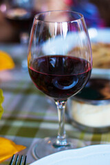 A glass of red wine in Italian restaurant in Siena, Tuscany, Italy. Food concept. Italian Cuisine