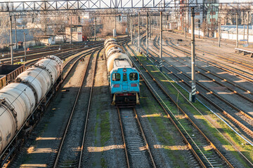 Kyiv (Kiev), Ukraine - January 2, 2020: Old and rusty freight cargo train, carriages, tank truck, oil tank car, cistern car, railroad, railway