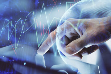 Multi exposure of man's hands holding and using a digital phone and forex graph drawing. Financial...
