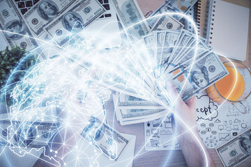 Obraz premium Multi exposure of financial theme drawing hologram and USA dollars bills and man hands. Business concept.