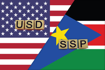 USA and South Sudan currencies codes on national flags background