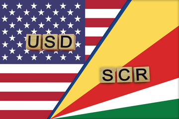 Fototapeta premium USA and Seychelles currencies codes on national flags background
