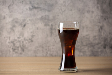 ice americano coffee on wood table in coffee shop loft style