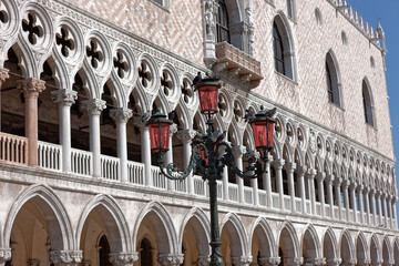 Fototapeta na wymiar front view closeup of white Doge's Palace white tracery facade in Venice, Italy, Europe