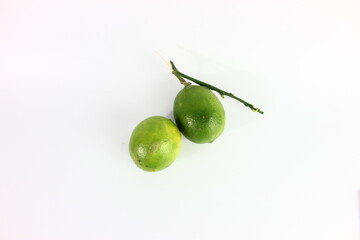 immature lemon in white background