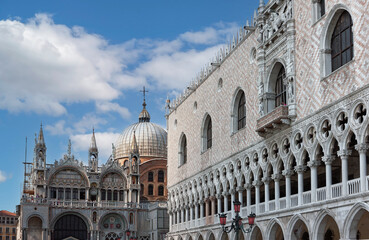 Fototapeta na wymiar front view closeup of white Doge's Palace white tracery facade in Venice