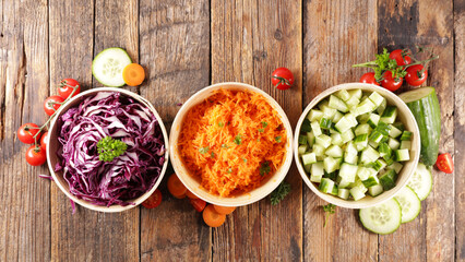 Obraz na płótnie Canvas vegetable salad- carrot, cabbage and cucumber