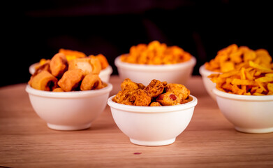 Indian Namkeen indian food in white bowl in white background,Namkeen in a bowl wooden background,