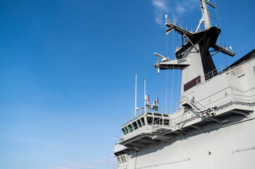 The military navy ship or warship against the blue sky. Maritime borders protection. Sea...