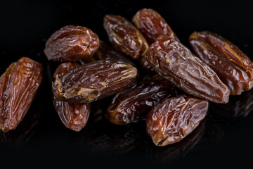 date fruit on a black background