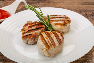 Grilled pork medallion with sauce