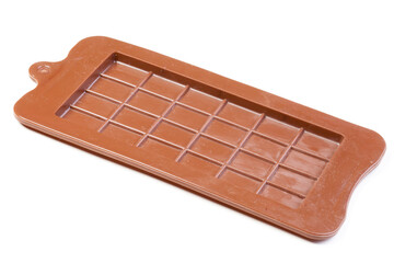
Brown silicone shape isolated on white background. Silicone mold for chocolate 