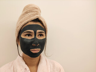 Woman with beauty mask, portrait of a woman wearing clay masks