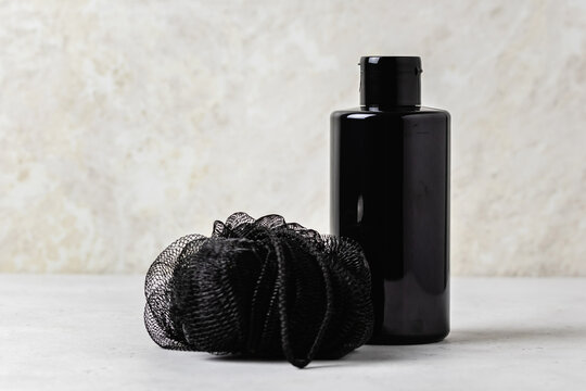 Moinimalist men cosmetics, black bottle, shampoo, body wash, wash cloth, soap. Space for text.