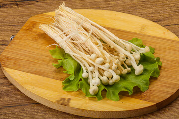 Raw Enoki mushrooms for cooking
