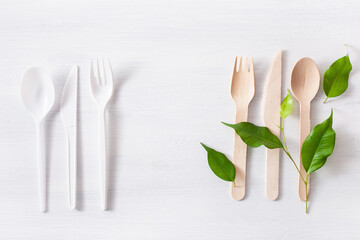 harmful plastic cutlery and eco friendly wooden cutlery. plastic free concept