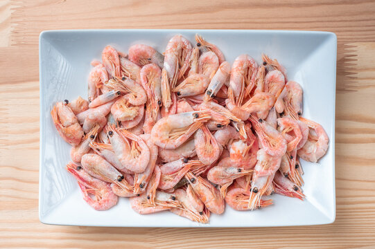 Boiled Atlantic Shrimp On White Plate. Boiled Shrimps In White Plate Close Up. Seafood Concept. Top View