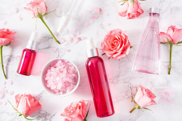 Fototapeta na wymiar bottles skincare lotion serum medical rose flowers. organic natural cosmetic