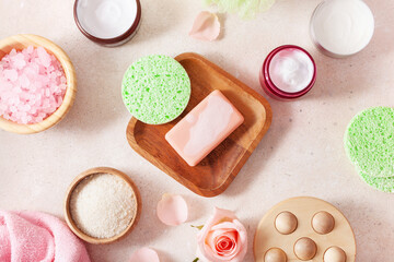 skincare products and rose flowers. natural cosmetics for home spa treatment