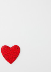 Red heart on a white background. Festive background. Minimalism. Copy space. St. Valentine's Day background