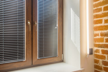 brown window with black blinds, loft, brick wall, industrial interior