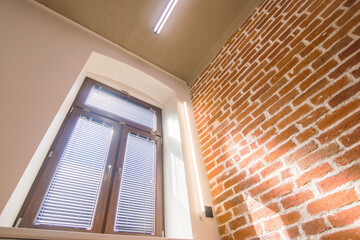 Brown window, bottom view, loft, brick wall, concrete ceiling, led tube, modern industrial room