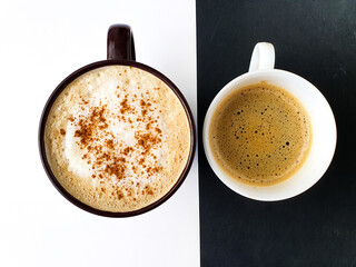 cup of coffee.  Coffee concept. Drink background. Creative layout made of Cappuccino on white background and coffe on black background.  Top view image of coffee cup. 