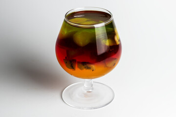 Jelly with kiwi and fruits in a cup