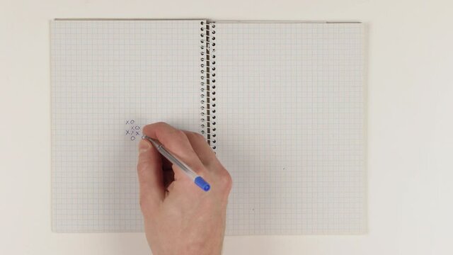 Playing gomoku five-in-a-row pen and paper version logic game, sped up timelapse