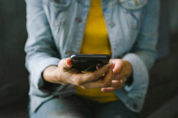 woman work using cell phone hand holding mobile texting message contact us.chatting,search internet information in office.technology device communication connecting
