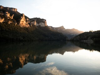 Reflection of mountains in Ebro river lake dam Embalse de Sobron on border of Basque Country...
