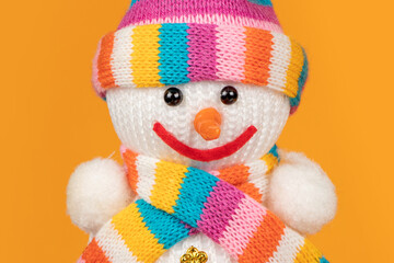 Handmade foam snowman on yellow background