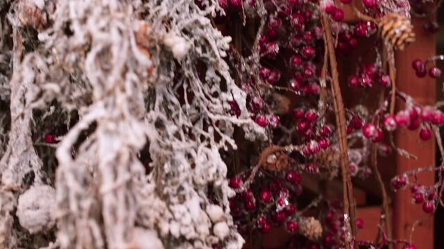Natural plant branches are dried and covered with snow and frost, are sold in the decor shop. The craft of intelligent design as an attempt to break free from the pejorative notion of artificial. 