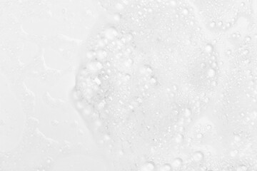 Fototapeta premium Abstract background white soapy foam texture. Shampoo foam with bubbles