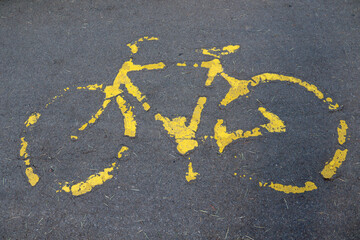 bicycle lane sign on asphalt