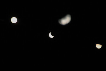 Abstract moon and lights during night time