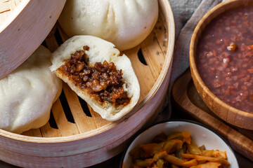 Chinese breakfast. Steamed buns and porridge are on the table
