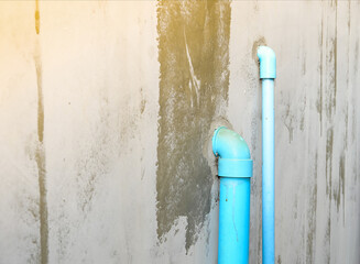 Blue PVC pipe water flow device for garden and drinking use.