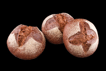 Freshly baked homemade bread isolated on black. Fresh dark rue bread. Healthy eating and traditional bakery, baking bread concept