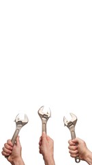 wrench in hand. set of tools. metal tool in a fist. device in the palm. the master holds an adjustable wrench