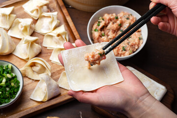 The chef is making meat wonton