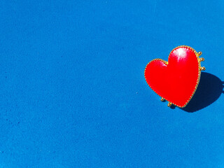 Fototapeta premium red heart on blue background. Valentine's Day background. Red heart on blue background. Valentines day concept. Flat lay. Copy space 